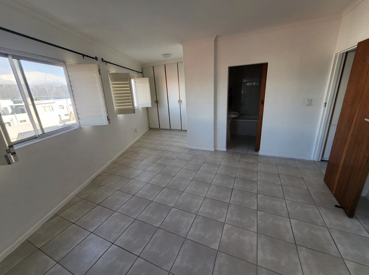 Room after floor tiling — new tile floor