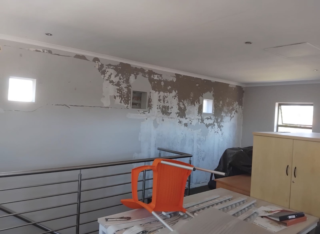 Wall before painting — peeling and damaged