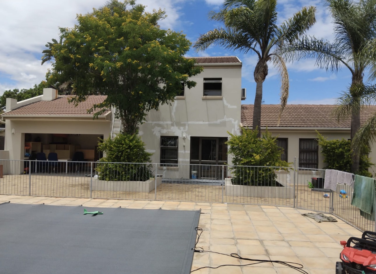 House exterior before painting — patchy walls