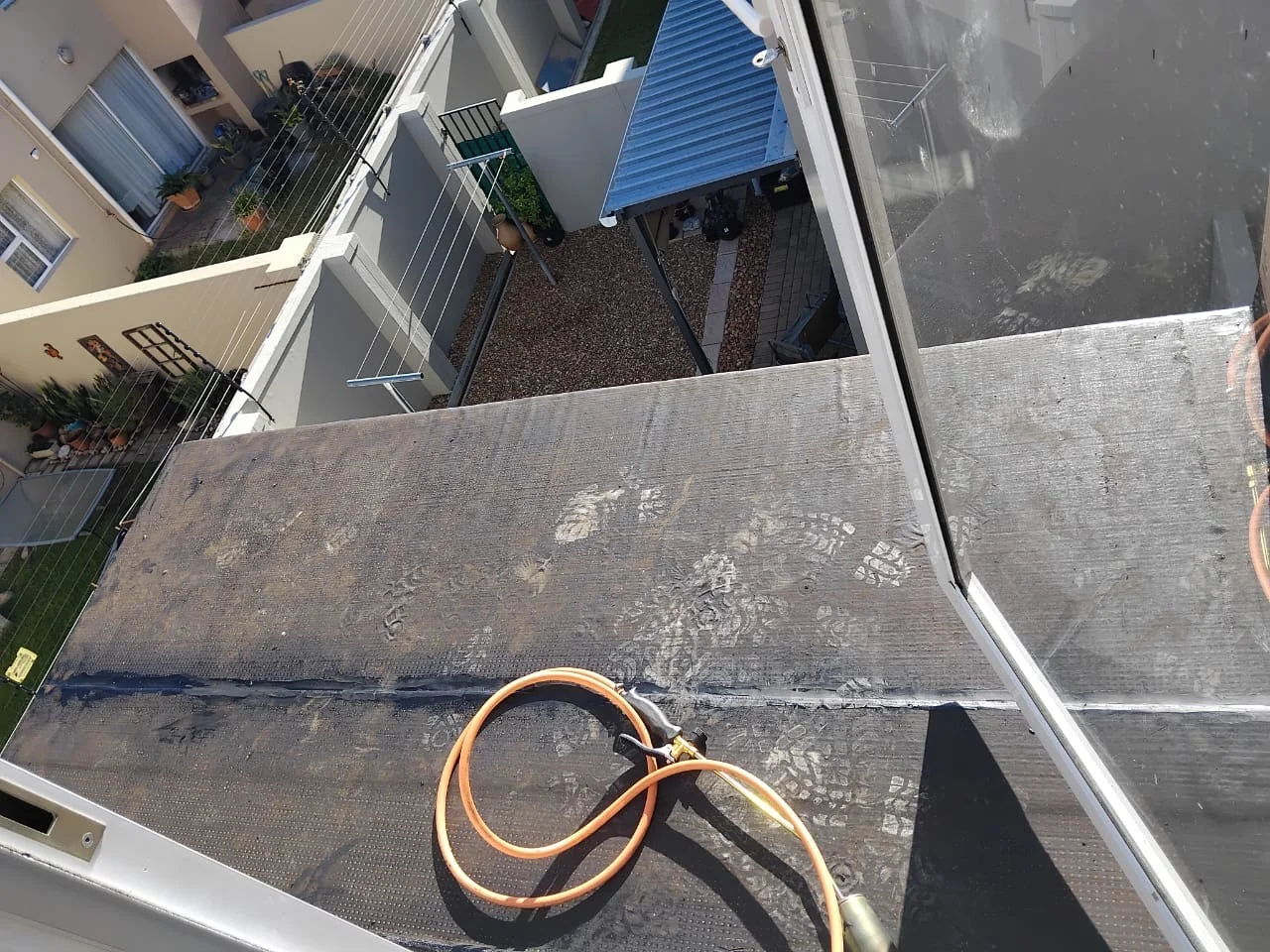 Balcony before tiling — bare waterproofing surface